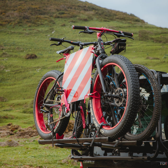 Fiamma rear-mounted bike rack with two bikes loaded on a campervan