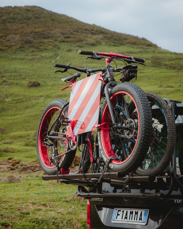 Fiamma rear-mounted bike rack with two bikes loaded on a campervan