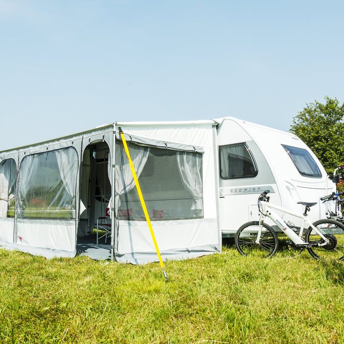 Fiamma cassette awning with privacy room and tie-down kit at a caravan campsite
