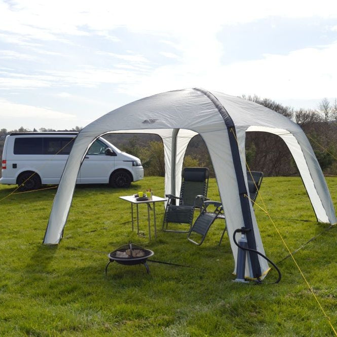 Maypole event shelter gazebo set up with camping chairs in the shade on a sunny day