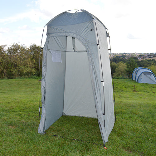 Portable toilet and utility tent pitched in a camping field