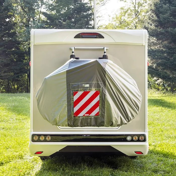 Caravan packed up ready to travel with bike rack and rear bike cover