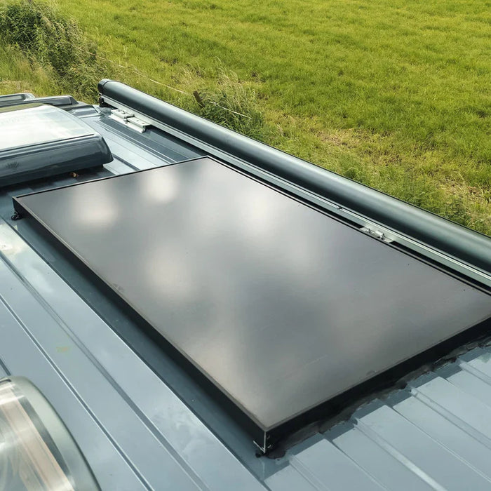 Mestic solar panel mounted on a campervan in sunshine