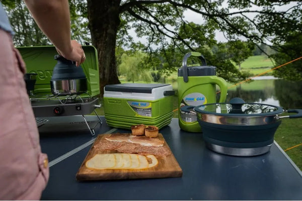 Vango Cuisine cooking setup with cooker, pots, pans and mini cool box
