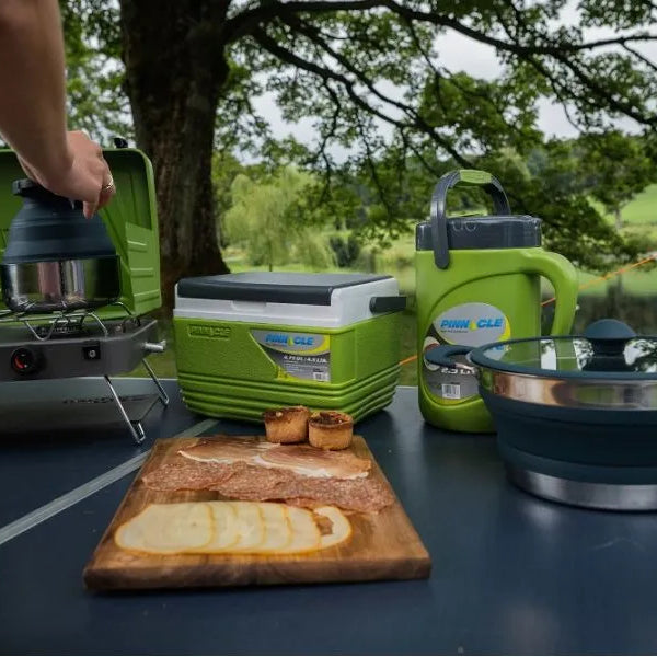Vango Cuisine cooking setup with cooker, pots, pans and mini cool box