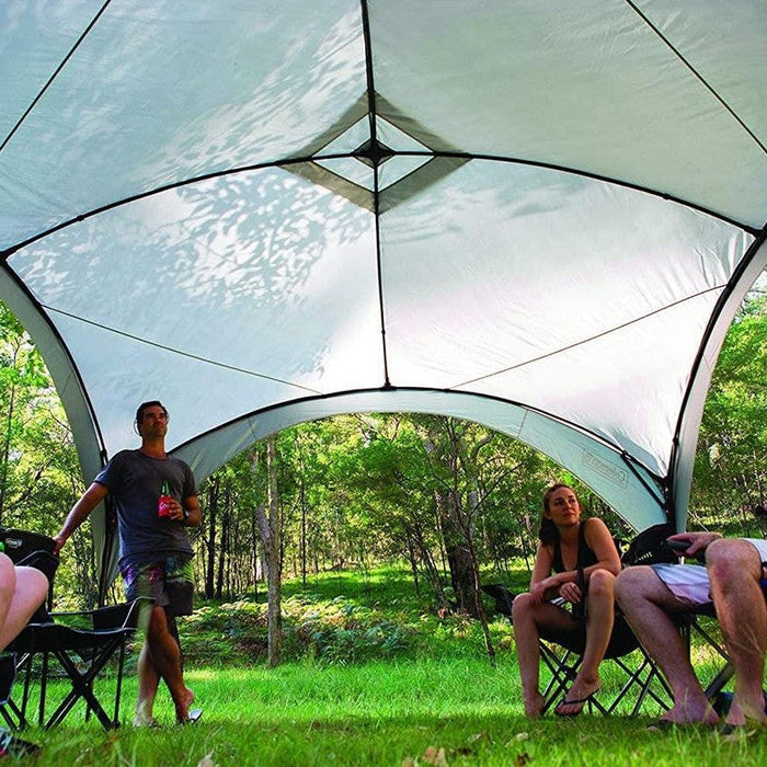 Coleman Fast Pitch event shelter gazebo set up at a sunny campsite