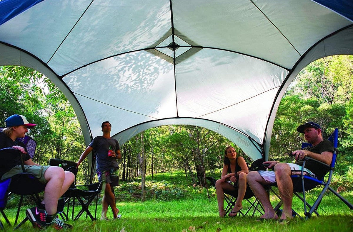 Coleman Fast Pitch event shelter gazebo set up at a sunny campsite